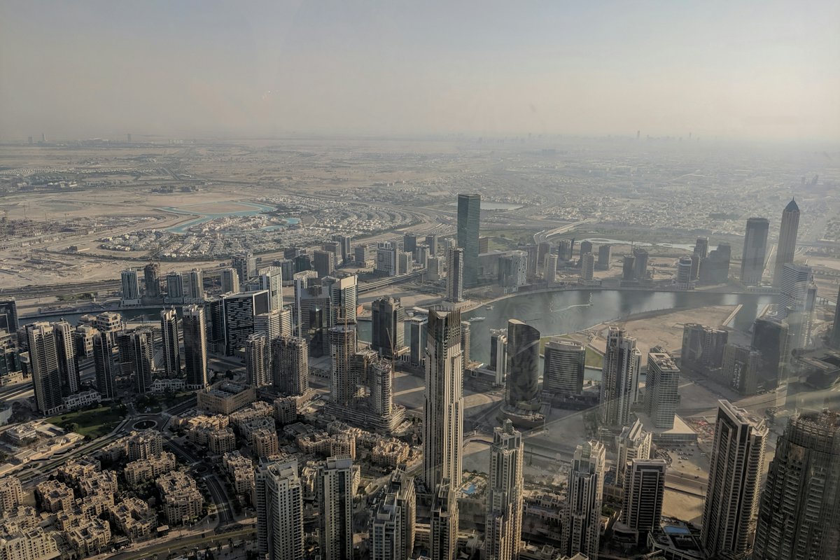 Aerial view of a modern city under a soft haze