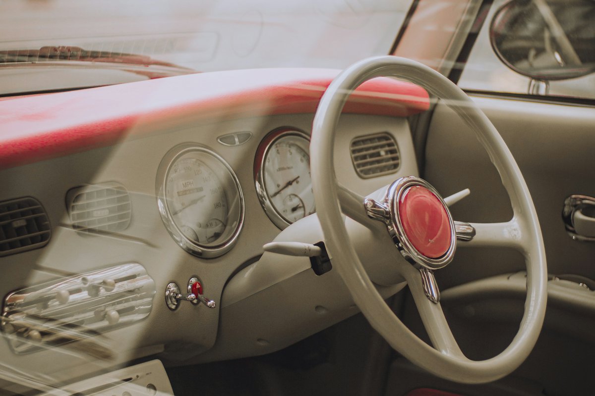 Classic car steering wheel and dashboard