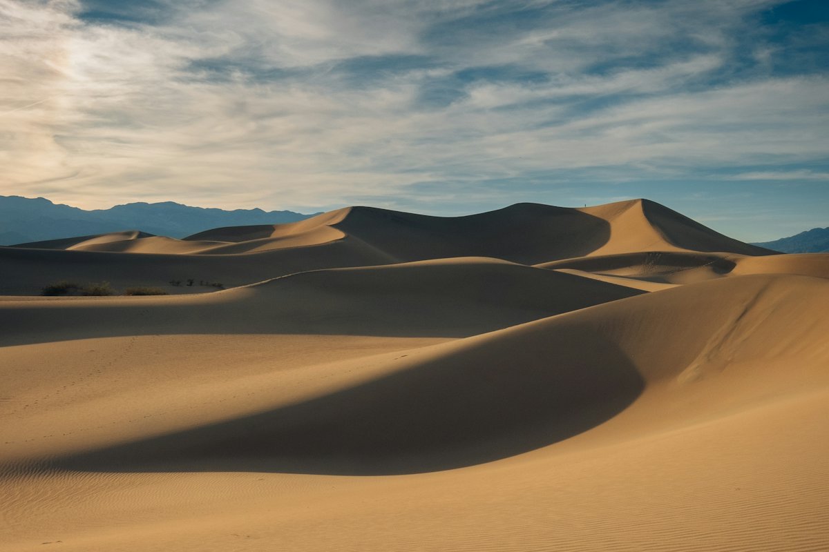Desert dunes under a blue sky