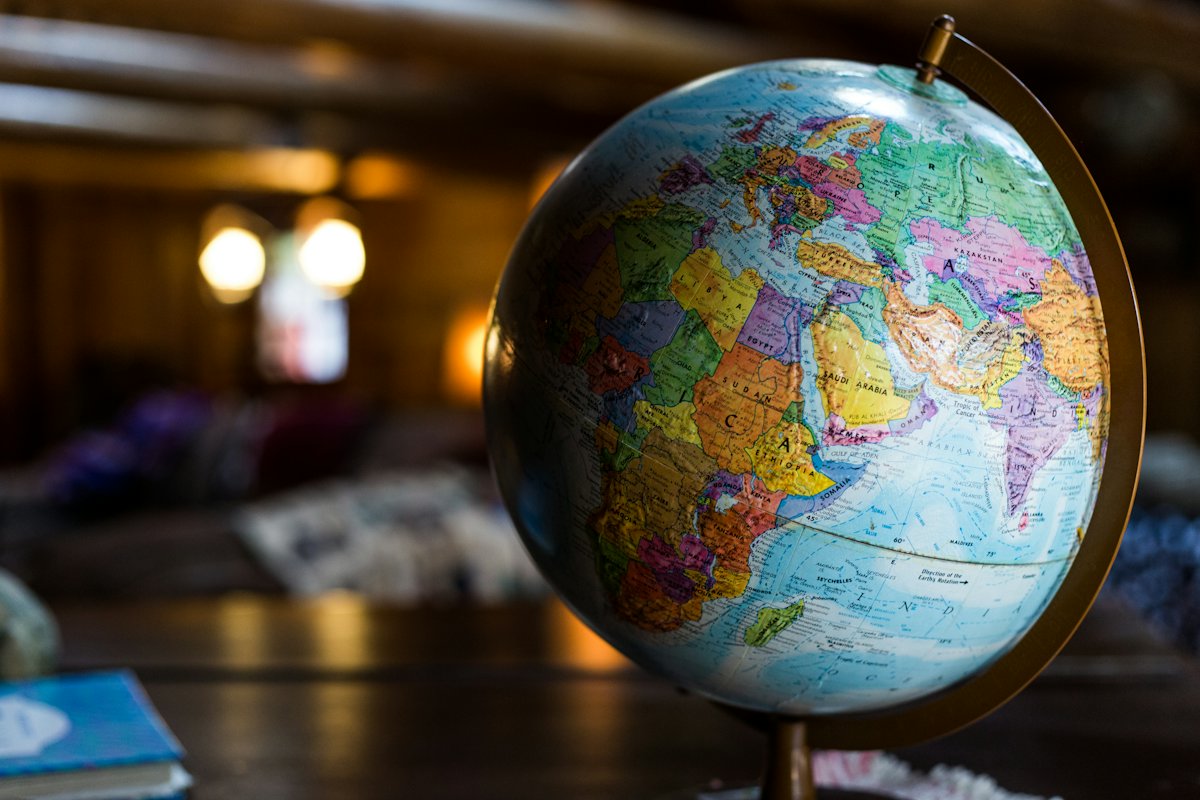 Desk globe lit by warm evening light