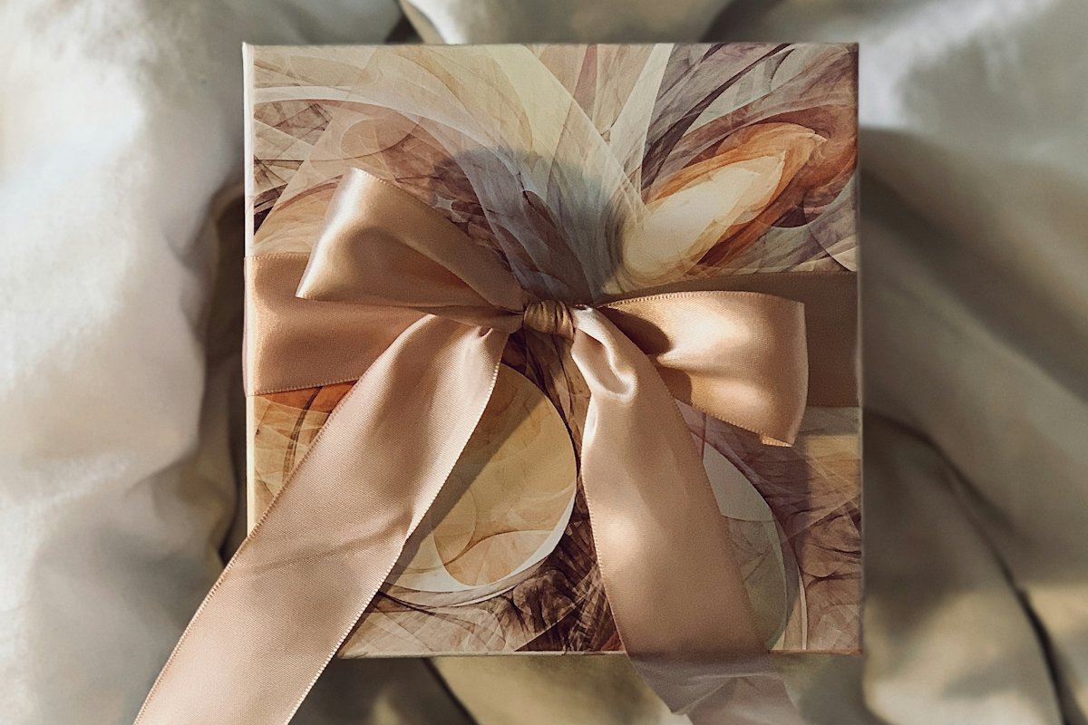 Gift wrapped with a gold satin ribbon