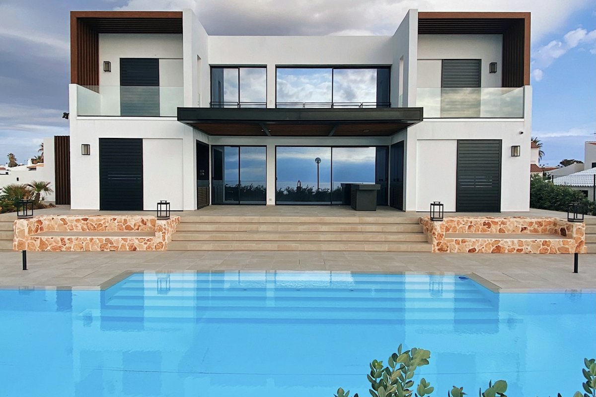 White modern villa with a swimming pool