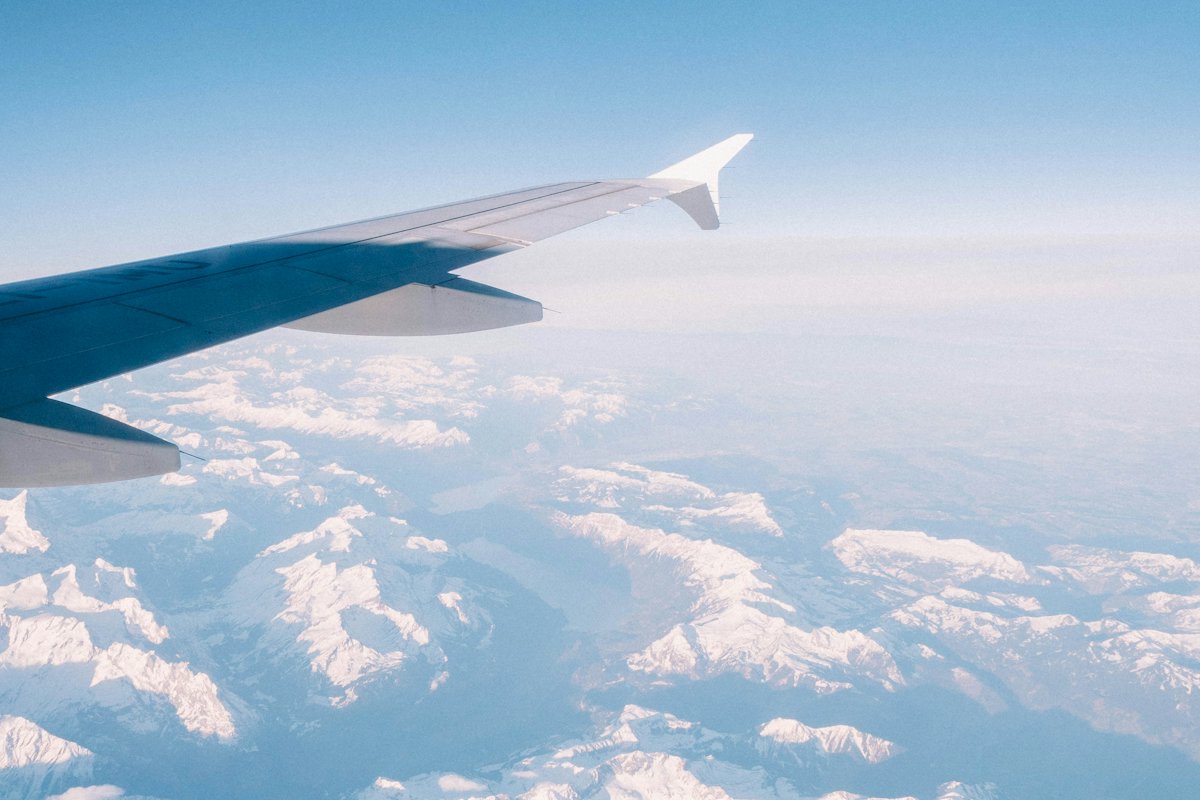 Aircraft wing above a sea of clouds